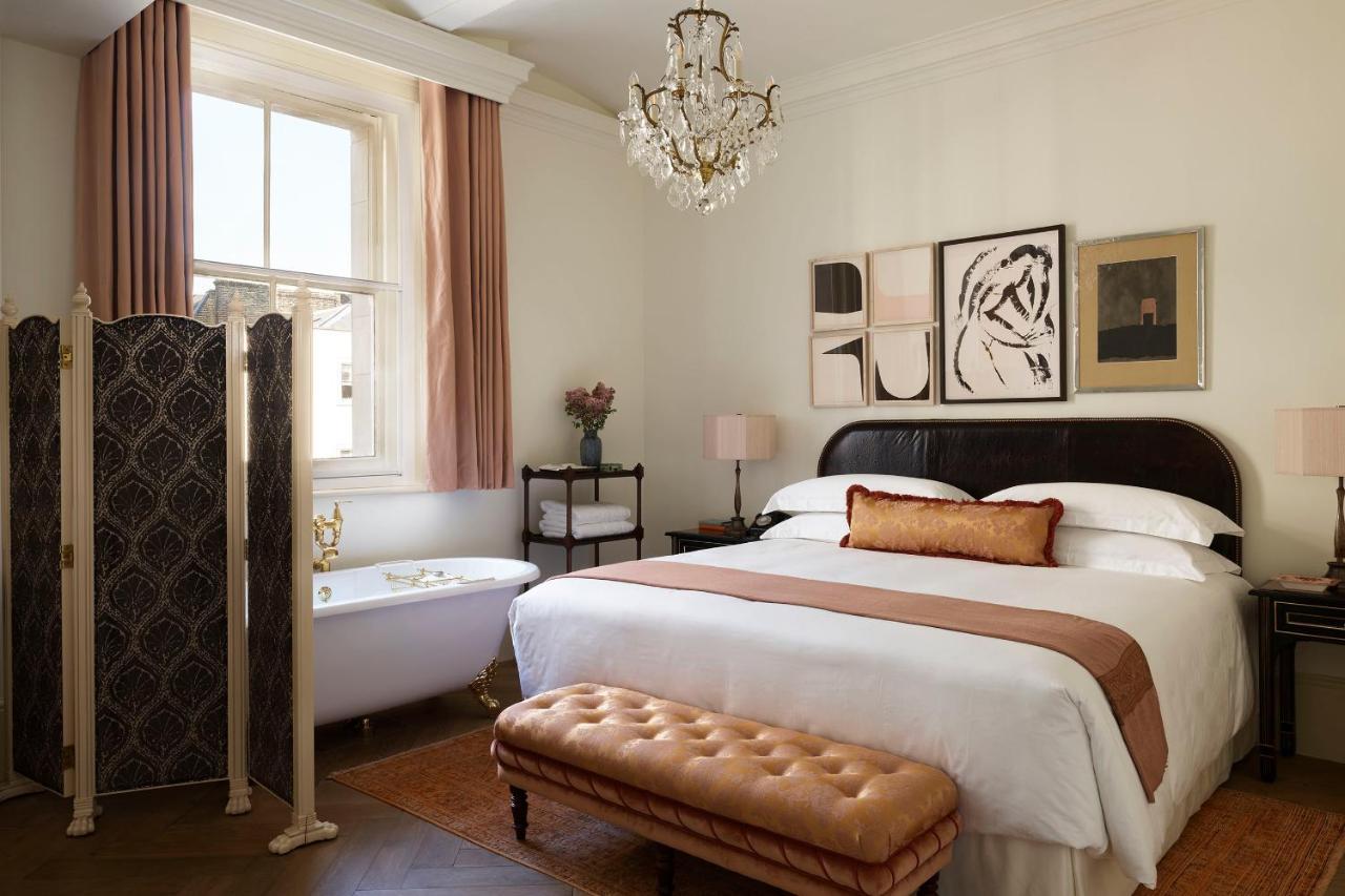 ホテル Nomad ロンドン エクステリア 写真 A bedroom at the Hotel George Washington